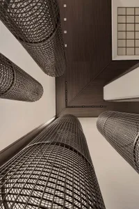 A modern interior design featuring metallic cylindrical structures.