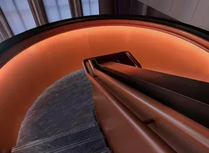 Modern metal staircase with orange lighting