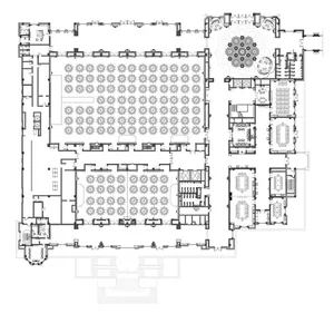 Detailed architectural floor plan of a conference hall with tables and seating arrangements.
