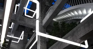 Industrial urban architecture featuring concrete structural elements and metal railings.