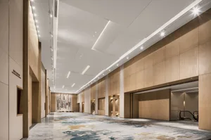 Long, modern hallway with wooden panels and marble flooring.