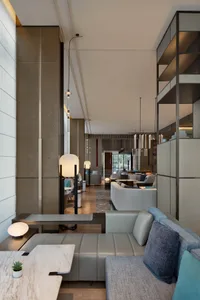 Modern hotel lobby with neutral tones and minimalist design.