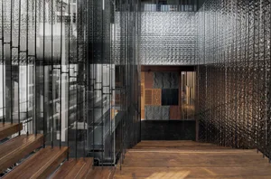 Modern industrial commercial interior with metal, glass, and concrete materials.