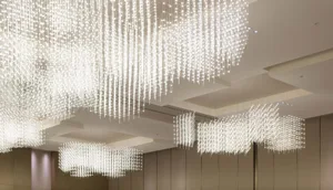 A series of modern interior LED lighting fixtures hanging from the ceiling.