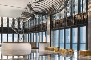 A modern lobby featuring metallic wave structures.