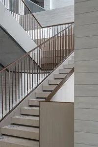 Concrete staircase with metal railings and minimalist design