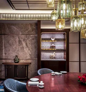 Modern restaurant interior with glass, marble, and wooden elements