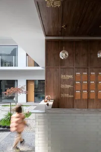Modern reception counter featuring marble and wooden materials, showing a contemporary design.