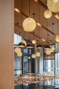 Modern café interior design featuring warm lighting and wooden elements