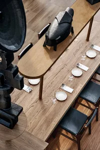Modern furniture and wood details in a restaurant interior design.
