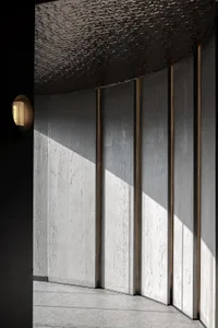 Modern interior space featuring concrete walls and lighting