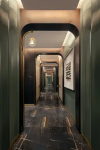 A modern marble corridor with green wooden accents and hanging lights.