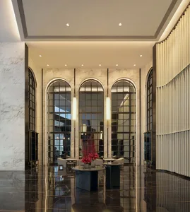Modern lobby interior with marble walls and glass panels.