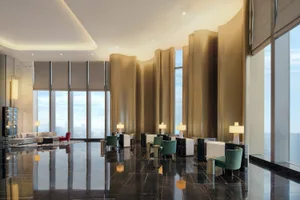 Modern lobby with marble flooring and contemporary furniture.