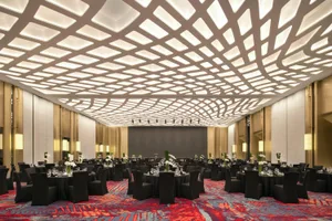 A modern conference hall with metallic finish tables and chairs