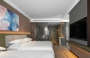 Modern bedroom suite featuring marble and wood elements.