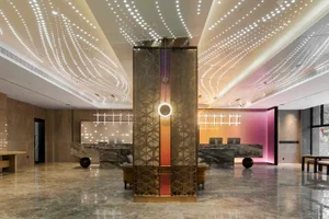 A modern commercial lobby featuring marble flooring and LED lighting fixtures.