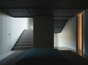 Staircase with concrete steps in a minimalist, modern interior
