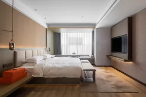 Modern bedroom featuring a neutral-toned color palette