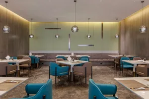 A sleek, modern restaurant dining room with contemporary decor and clean lines.