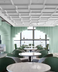 A contemporary restaurant interior featuring modern design elements like green acrylic columns and a coffered ceiling.