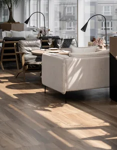 Modern living room featuring hardwood flooring, contemporary furniture, and stylish decor.