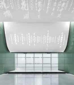 A modern lobby featuring glass walls and a minimalist design.