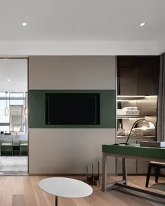 A modern residential kitchen featuring sleek, dark teak cabinetry and a contemporary design aesthetic.