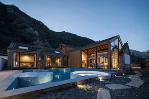 Modern residential house with a pool and wooden exterior