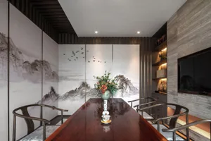 A modern dining room with wooden table, chairs, and decorative elements.