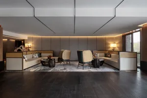 A modernist lobby with concrete tiles, wooden accents, and cozy seating arrangements.