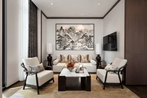 Living room with neutral-toned leather sofas, wooden coffee table, and abstract art on the wall