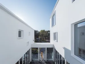Minimalist white building with glass panels