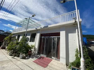 Modern house exterior featuring a concrete and glass design