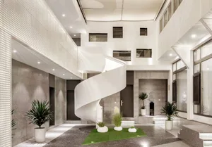 A modern interior space featuring industrial elements, concrete walls, and glass elements.