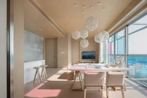 Modern living room featuring a wood and glass interior design.