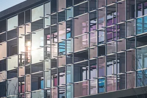 A modern glass office building with a contemporary design.
