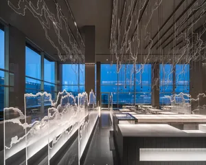 Modern industrial restaurant interior with glass and steel elements