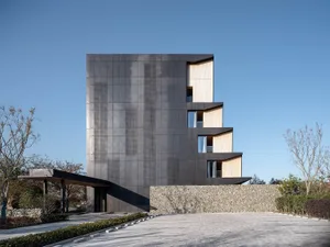 Modern building with concrete and glass exterior.