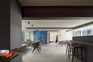 A modern residential living room with concrete flooring.