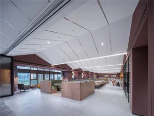 Modern office space with concrete flooring, metal accents, and modern décor.