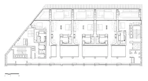 Floor plan of a residential building with multiple units, showing rooms and layout.
