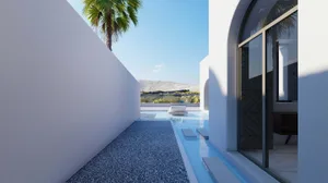 A serene minimalist residential pool area with concrete walls and palm trees in the background.