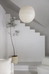 A minimalist interior with white tiles and concrete walls