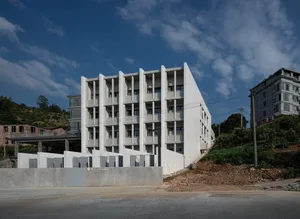 A modern office building made of concrete.