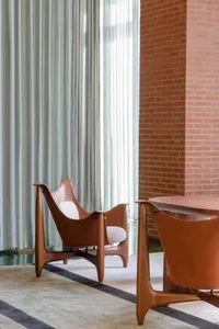 Modern office space featuring wooden furniture and leather accents
