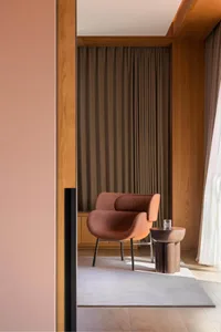 Modern interior design living room with wooden furniture, minimalist decor, and a cozy ambiance.