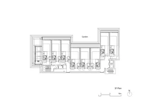 Floor plan of a modern residential building with concrete and glass materials.