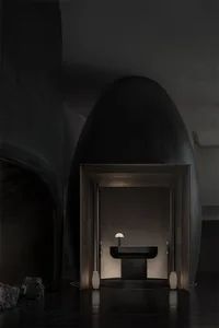Modern bathroom with minimalist design featuring a concrete floor and walls.