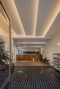 Interior design of a modern cafe bar featuring wooden furniture.